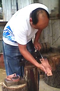 Anselmo Miranda making letter opener